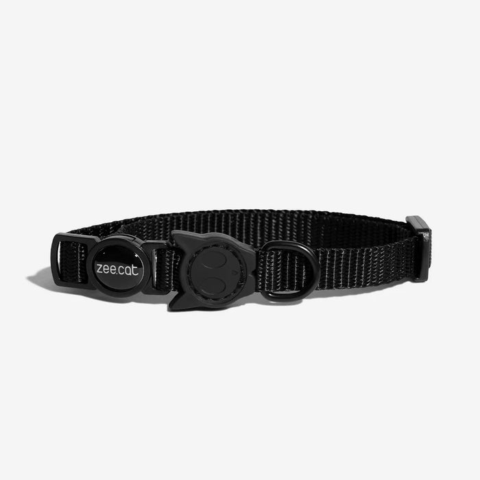 Black collar with a gold decorative buckle on a white background