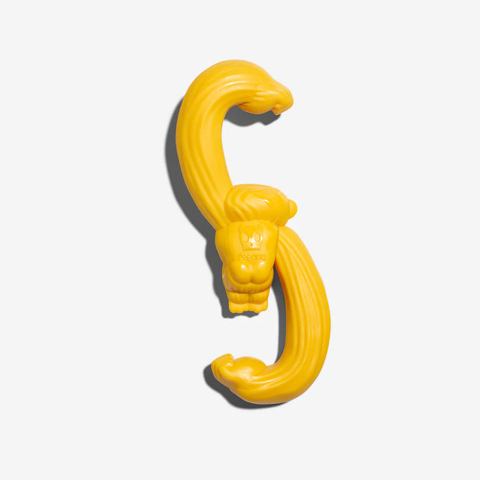 Yellow gorilla dog toy on a white background