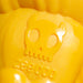 Yellow dog toy with a skull and zeedog text