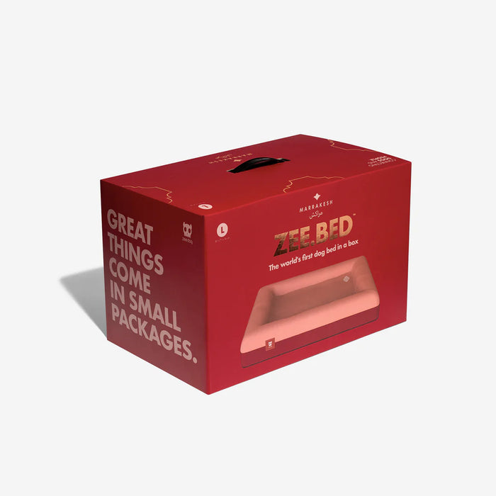 Red box packaging for Zee Bed with text on a white background