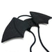 Black butterfly-shaped hair accessories on a white background