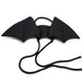 Black bat-shaped wings with a string on a white background