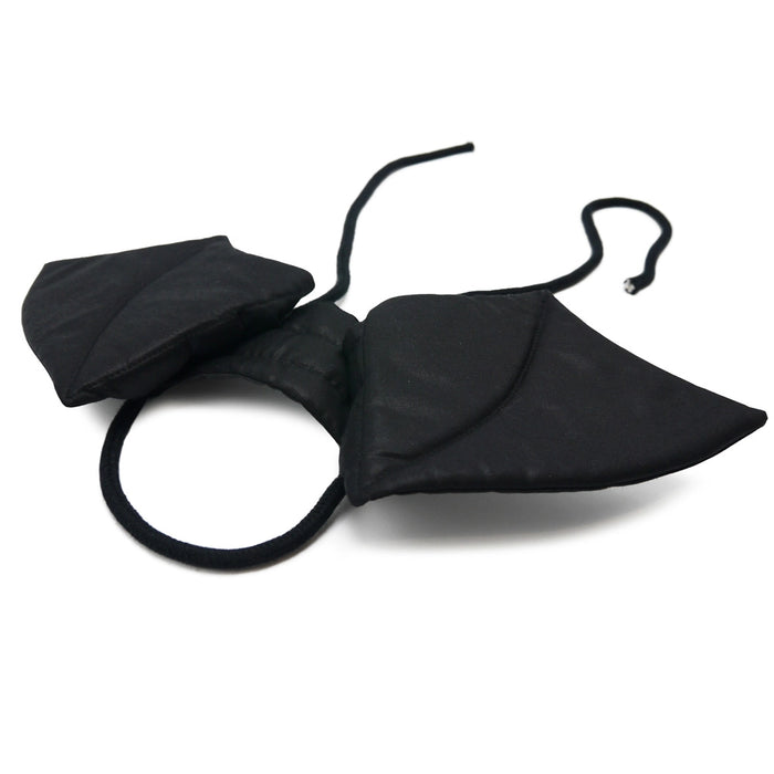 Black bat-shaped product on a white background