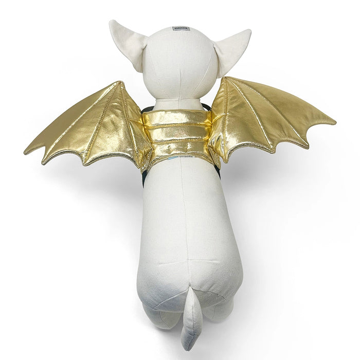 White plush toy with gold bat wings on a white background