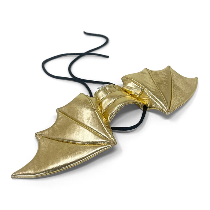 Gold bat-shaped earrings on a white background