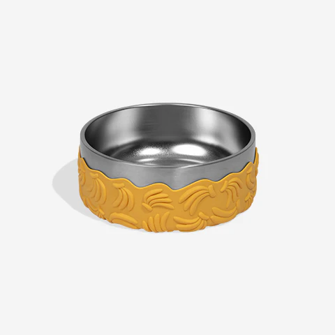 Stainless steel bowl with yellow silicone rim on a white background