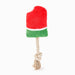 Red and green dog toy with a rope on a white background