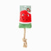 Red watermelon-shaped dog toy with a green base and rope, on a white background