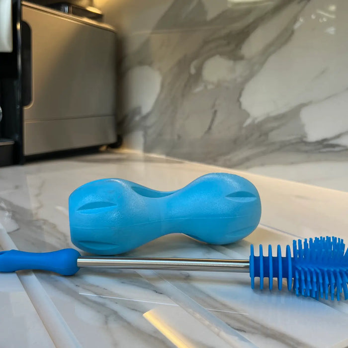 Dog Toy Brush with dog toy on kitchen surface