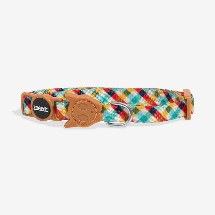Colorful plaid cat collar with brown leather accents on a white background
