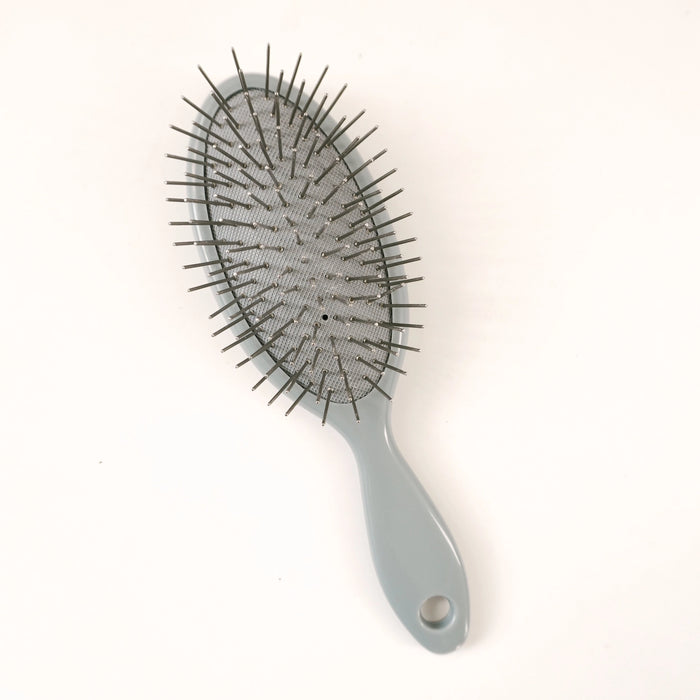 A gray oval hairbrush with black bristles, shown on a plain white background.