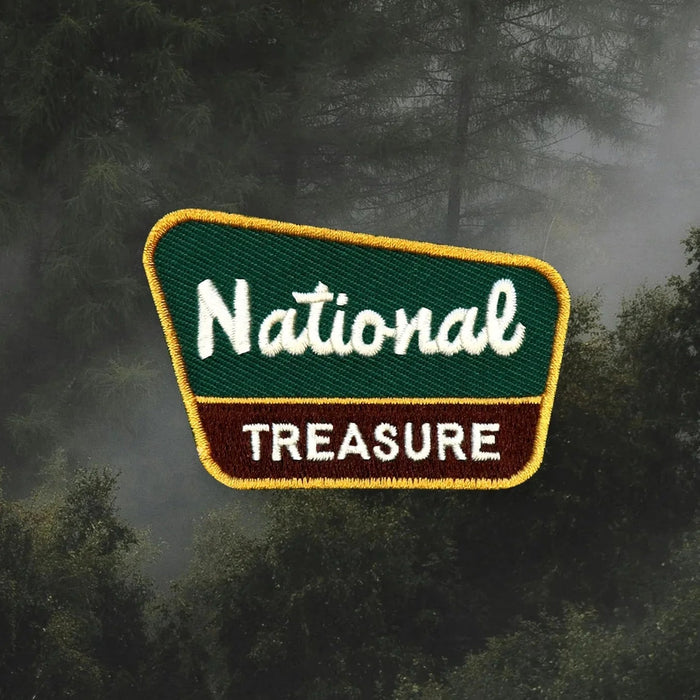 Patch with 'National Treasure' text on a forest background