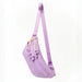 Purple sling bag with floral details on a white background