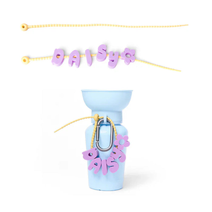 Light blue bottle with pink 'DAISY' letters on a white background