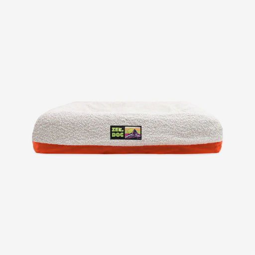 White boucle pet bed on a white background