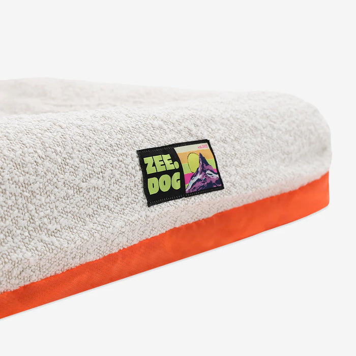 White boucle pet bed on a white background
