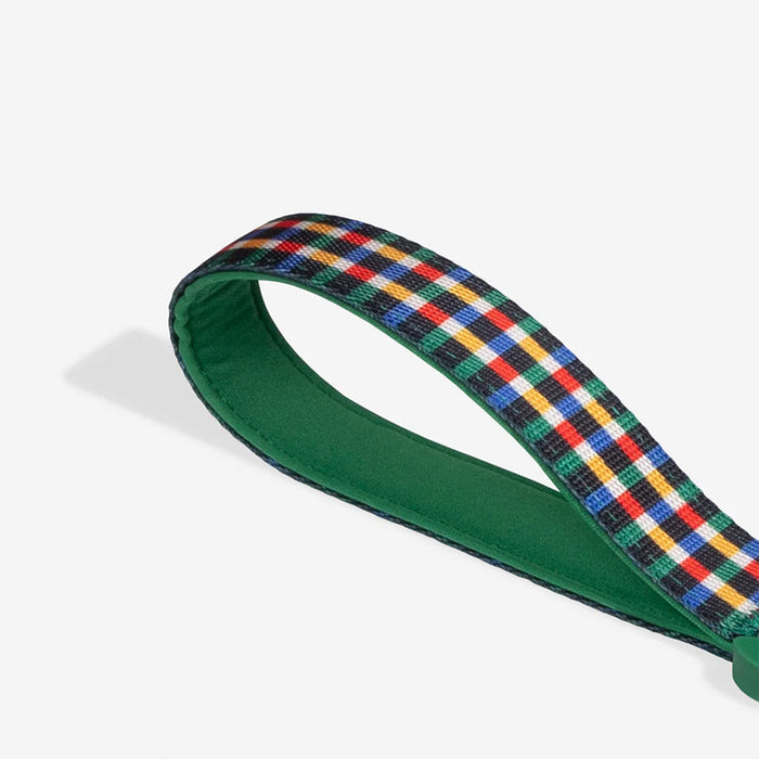 Green strap with a plaid pattern on a white background