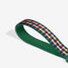Green strap with a plaid pattern on a white background