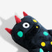 Plush toy with red horns and colorful spots on a white background