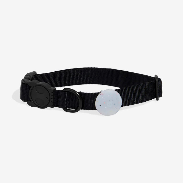 Black dog collar Round, white airtag holder with colourful specks on a light grey background