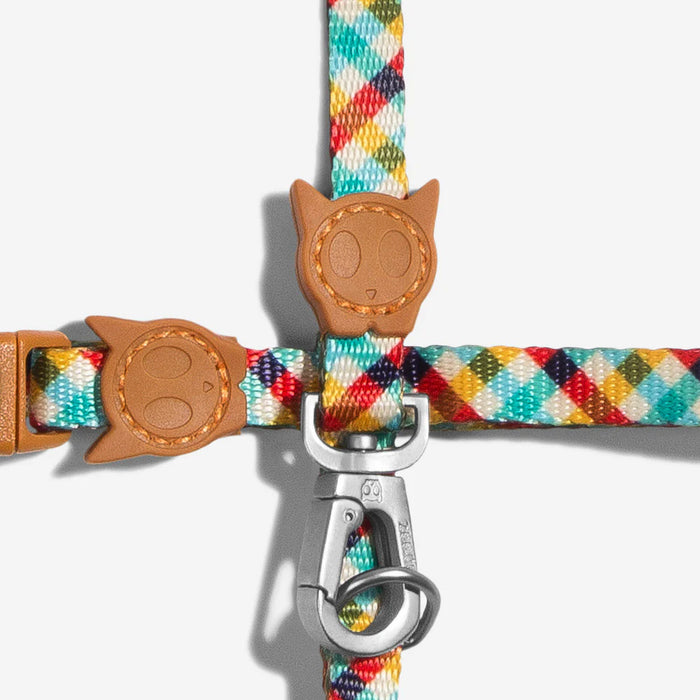 Colorful  cat leash with brown leather cat-shaped clips on a white background