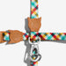 Colorful  cat leash with brown leather cat-shaped clips on a white background