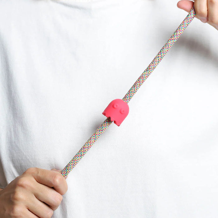 Pink rubber pinz with hands on a rope lead and white t shirt