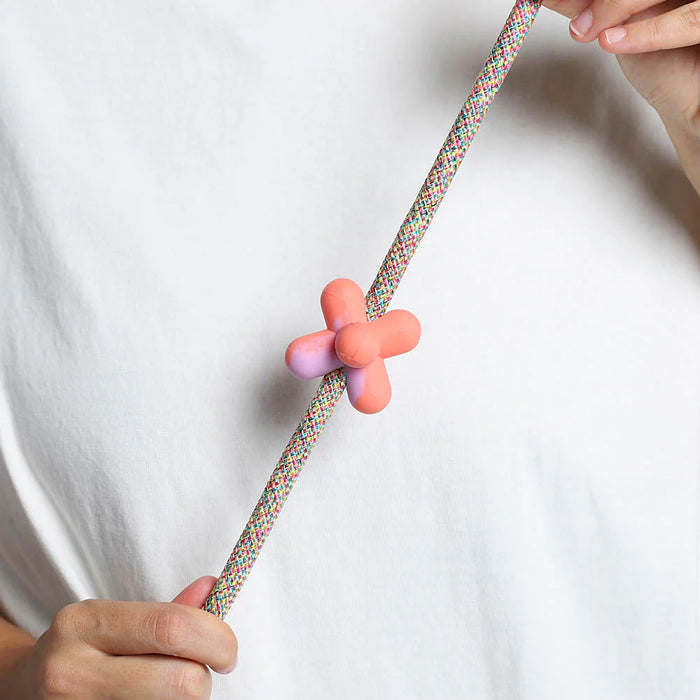abstract rubber pinz with hands on a rope lead and white t shirt