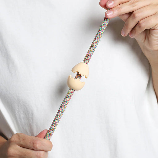 egg rubber pinz with hands on a rope lead and white t shirt