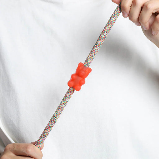 red gummy bear rubber pinz with hands on a rope lead and white t shirt