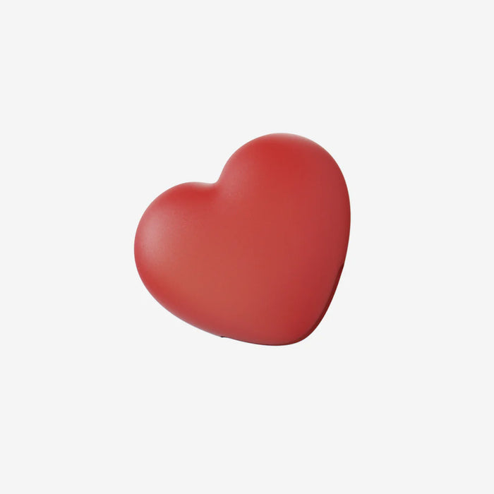 Red heart-shaped object on a white background
