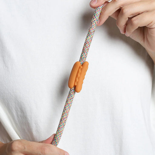 hot dog rubber pinz with hands on a rope lead and white t shirt