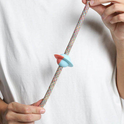 saturn rubber pinz with hands on a rope lead and white t shirt