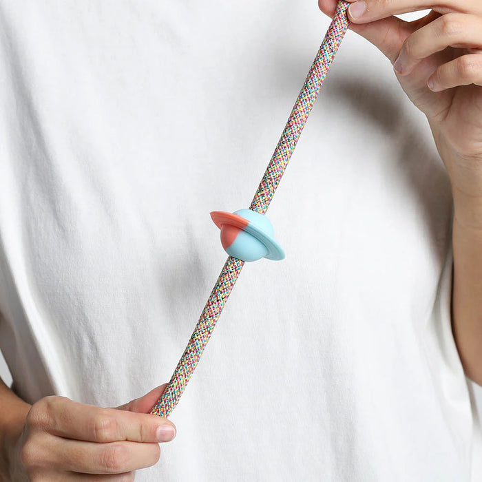 saturn rubber pinz with hands on a rope lead and white t shirt