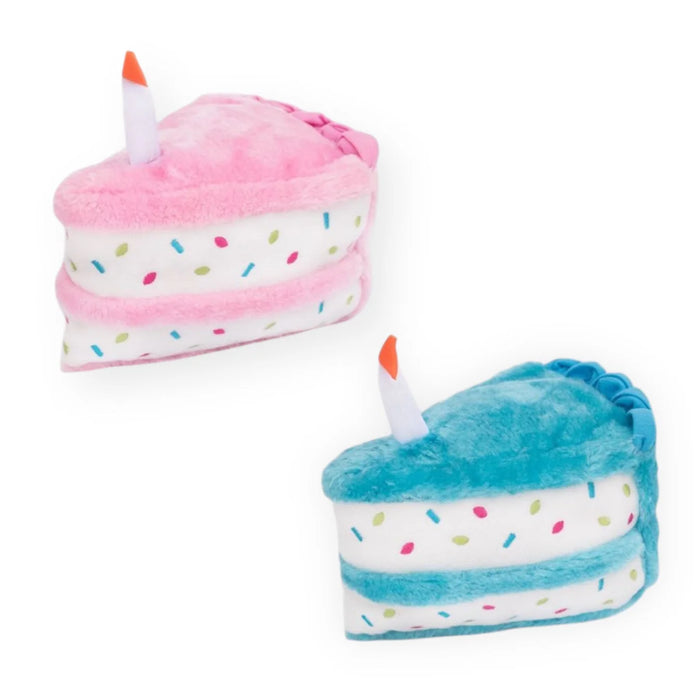 Two plush cake toys, one pink and one blue, on a white background.