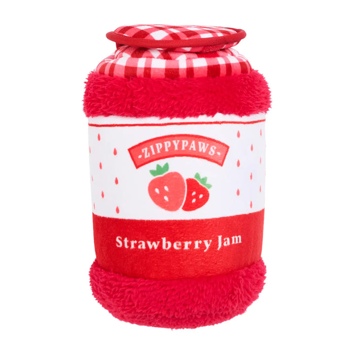 A plush pet toy shaped like a strawberry jam jar, featuring red faux-fur sides and top, a red-and-white gingham lid, and a white label with strawberry illustrations and the text 'Zippypaws' and 'Strawberry Jam'.