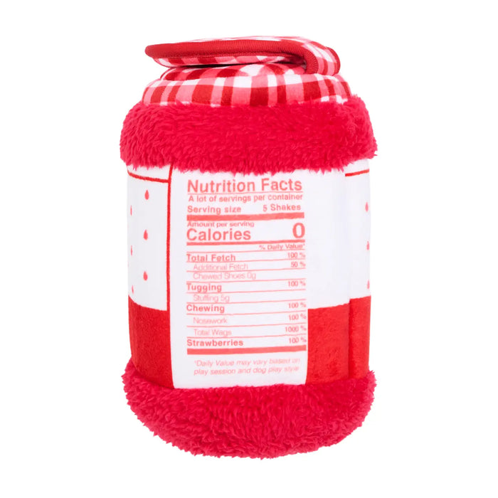 A plush red and white striped container-shaped toy or cushion with a fuzzy red base, a red-and-white checkered top, and a printed Nutrition Facts label on the front, shown on a plain white background.