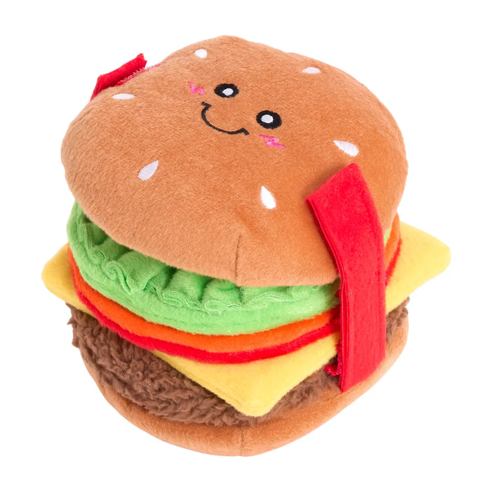 Plush toy shaped like a hamburger with a smiling face on a white background
