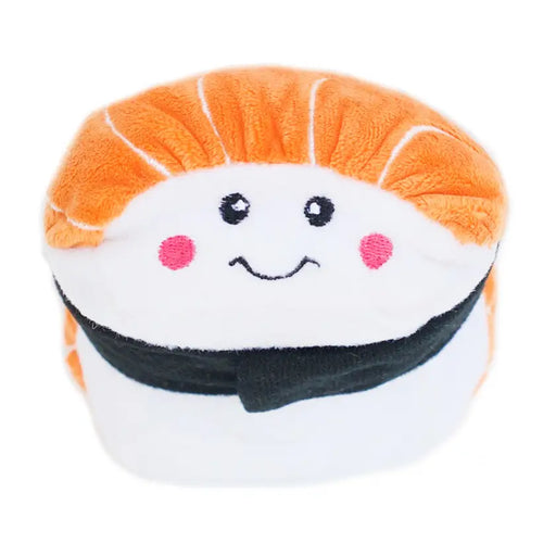 A plush sushi toy shaped like a piece of nigiri sushi, with orange hair, a white face, pink cheeks, and a black belt, shown against a plain white background.