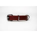 Red dog collar by the brand bendl. The collar is made from old red firehose and has silver toned hardware.