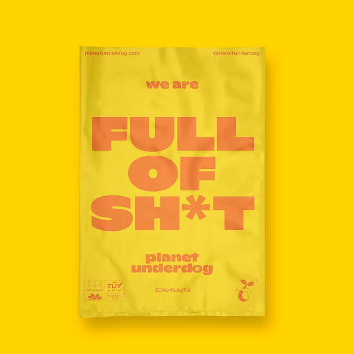 The image features a single yellow Planet Underdog poo bag, reading "we are Full of Sh*t"