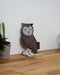 NufNuf Suede Owl dog toy in grey with white accents and a leather NufNuf label on a wooden table.