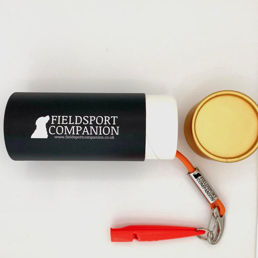 Fieldsport companion orange training whistle in cylindrical packaging with golden coloured lid