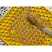 Peanut butter spread out on a Yellow Honeycomb patterned licking mat by Sodapup