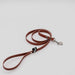 Picture of the Red Upcycled Firehose Lead, pictured on a white backdrop
