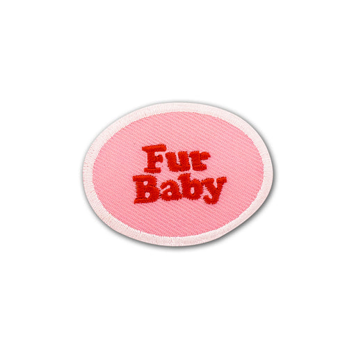 Scouts Honour Fur Baby iron-on badge in Pink and red complemented by a white round border.