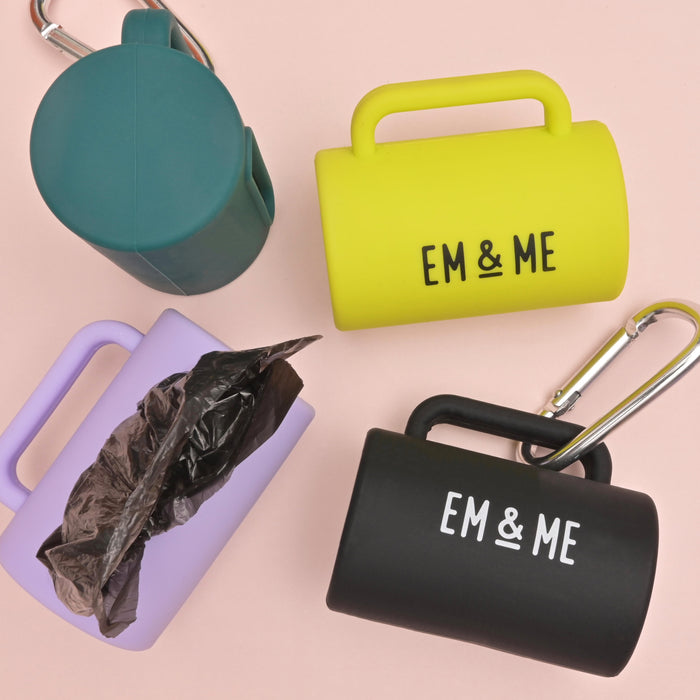 A range of Silicone Poop Bag Holders by Em and Me Studio, displayed in tennis ball yellow, lavender, black and green.