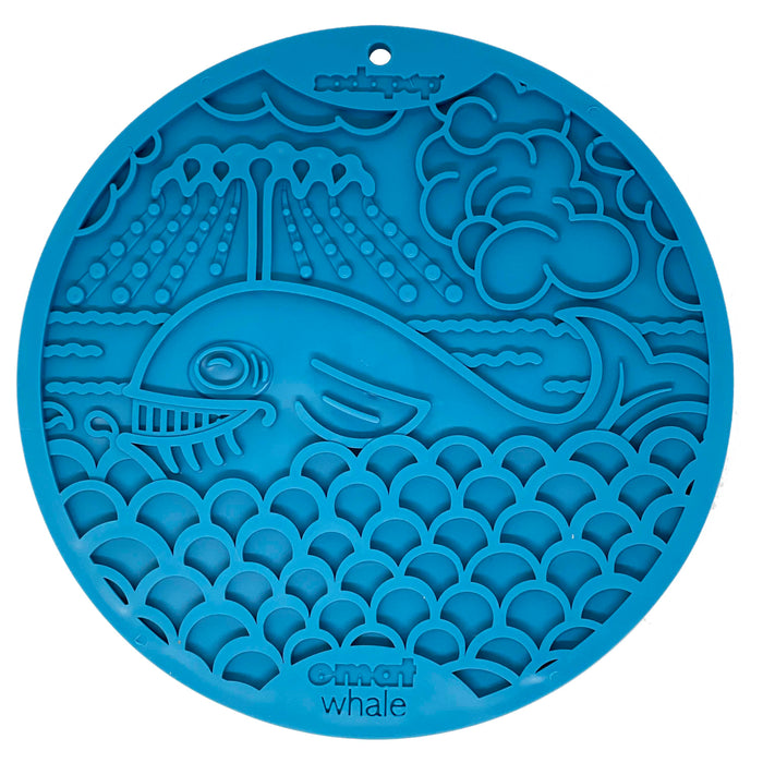 A blue silicone lick mat with a whale design, intended for use with dogs.
