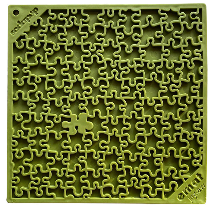 a green jigsaw designed lick mat